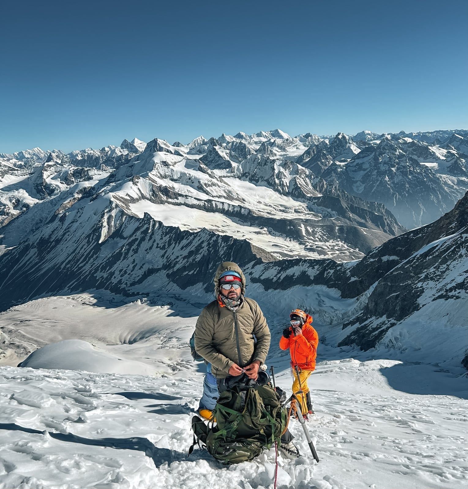 Climbers ascending the ice wall on Black Peak