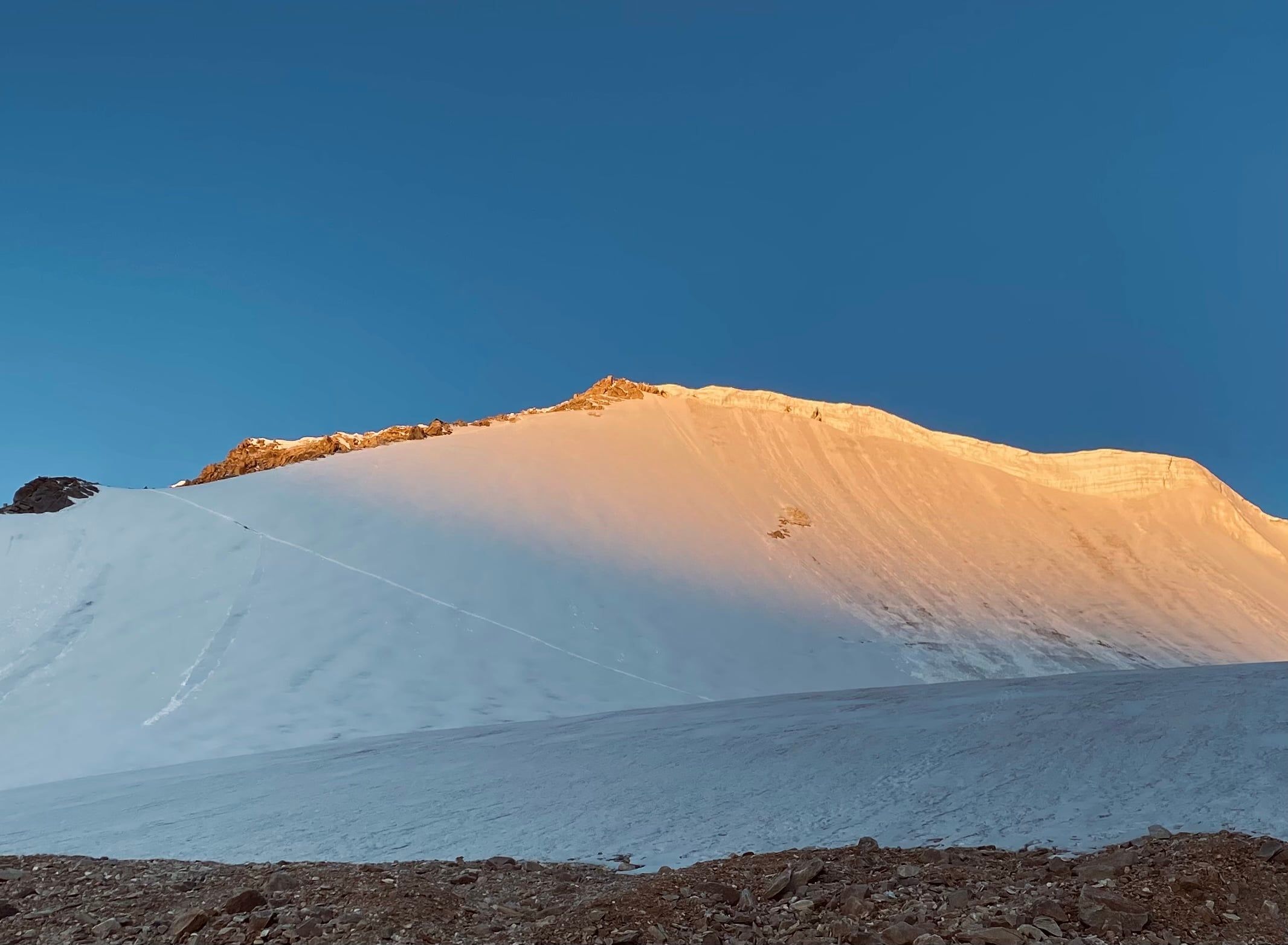 Sunrise alpenglow on the Mentok Kangri summit ridge
